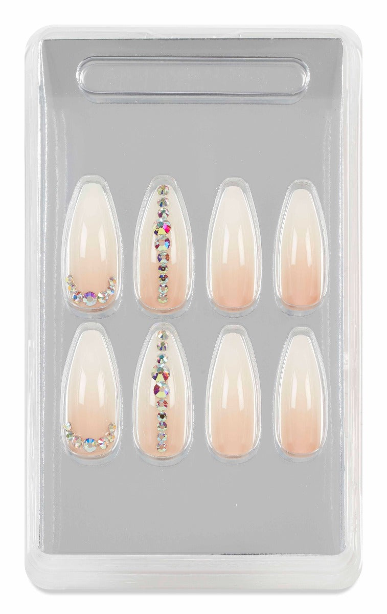 Packaged nude gradient press-on nails with rhinestone details, neatly arranged for an elegant and natural look.