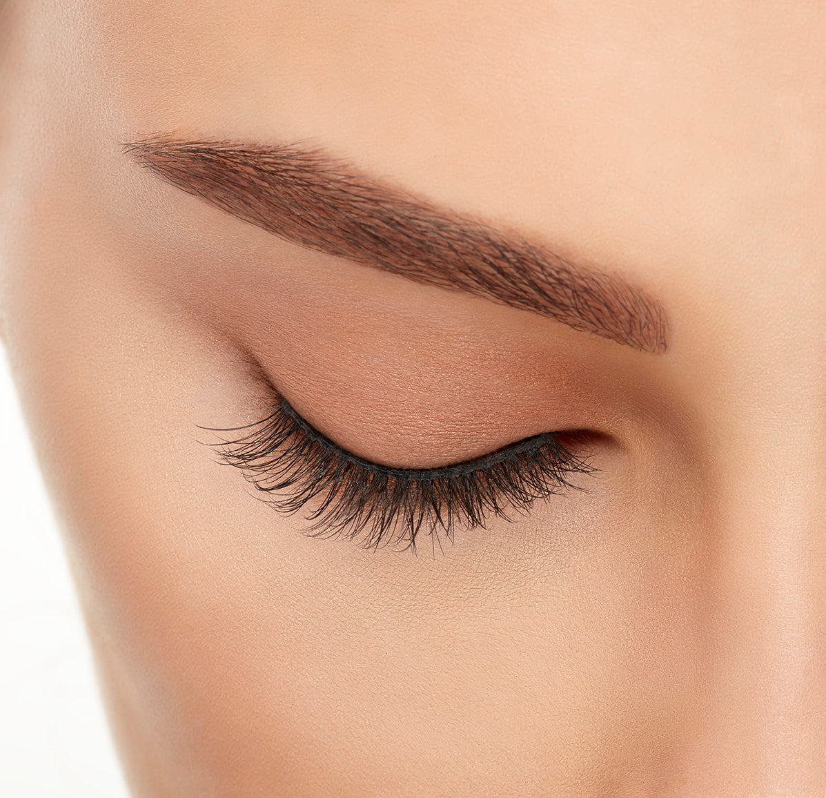 Close-up of a model&#39;s closed right eye wearing an Ardell Lift Effect 740 faux lash