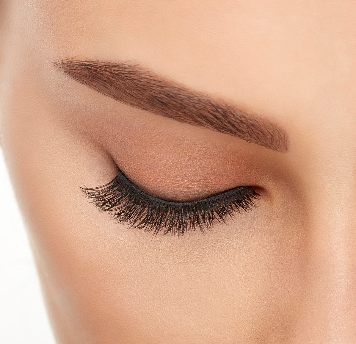 Close-up of a model&#39;s closed right eye wearing an Ardell Lift Effect 741 faux lash