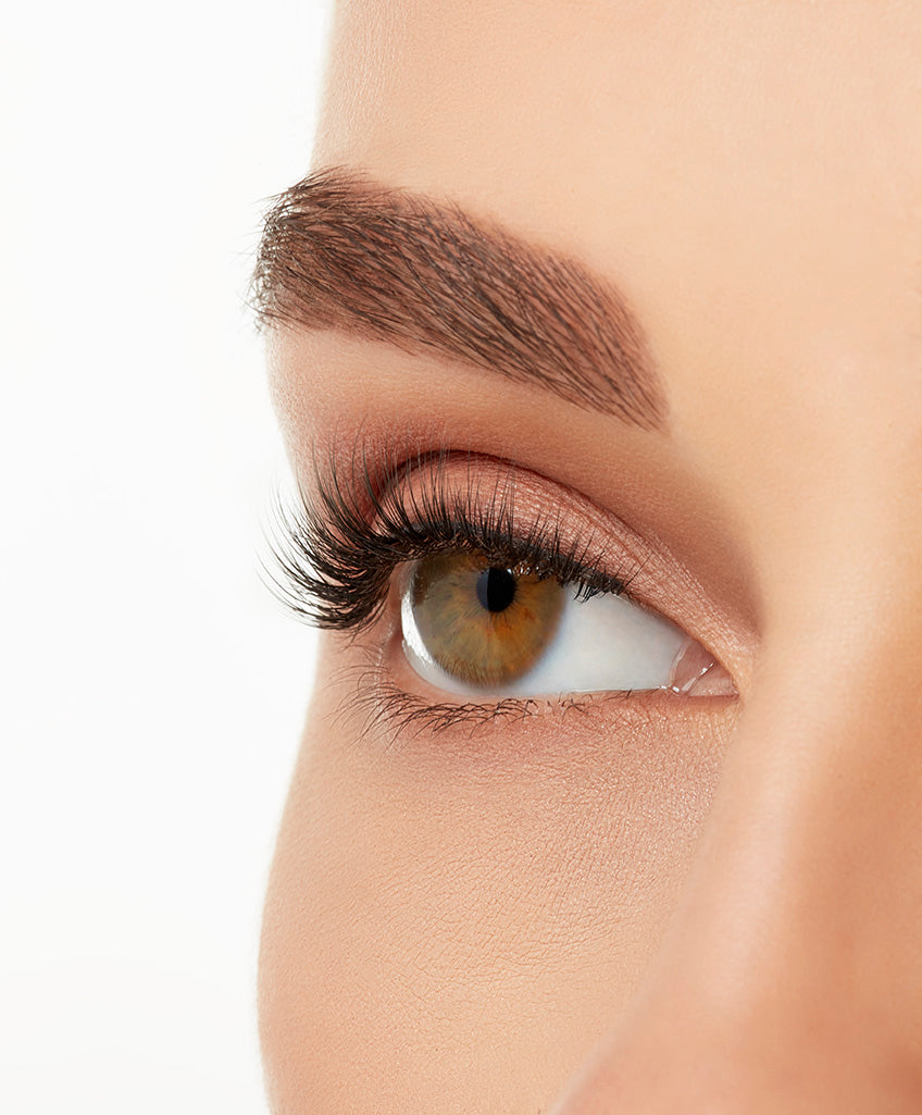 Angled close-up of a model's open right eye wearing an Ardell Lift Effect 745 faux lash