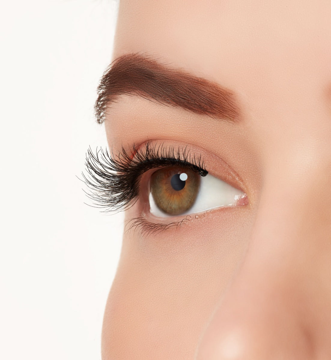 An extreme side close up shot of a model&#39;s eye wearing Ardell&#39;s Ecolashes 451 creating natural, round flared eyelash