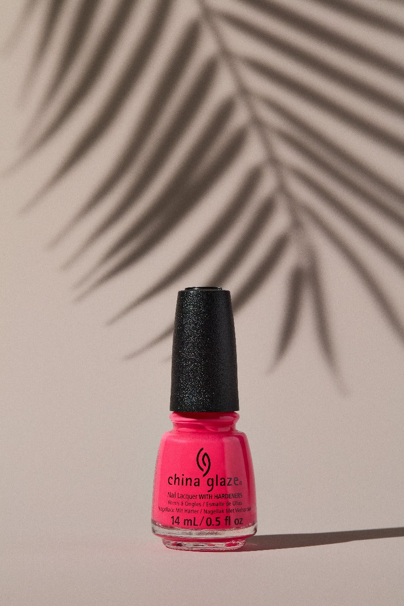 Expansive view of a colorant for a nail with palm leaf shadow as background
