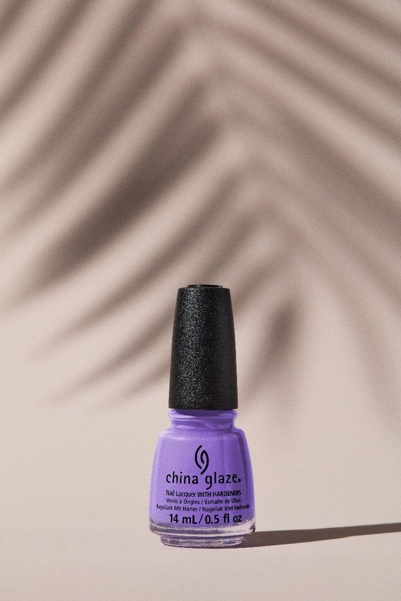 Expansive view of a colorant for a nail with leaf shadow as background