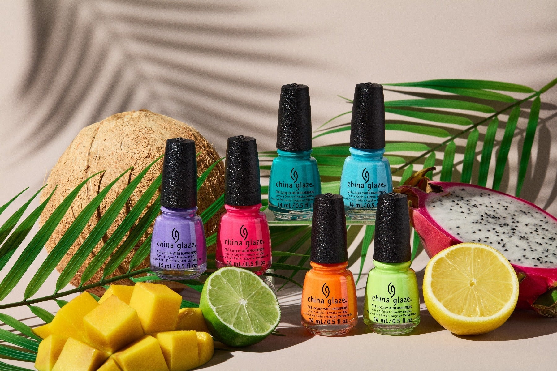 Different colors of nail polish from China Glaze Collection with tropical elements in a 3D presentation