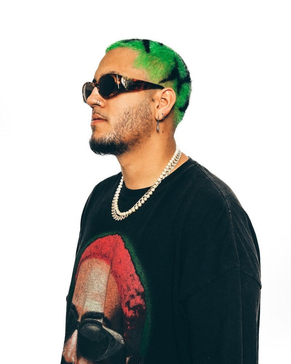Neon Green Hair with Black Design – A trendy short haircut featuring neon green dye with black accents, styled with a modern, edgy look.