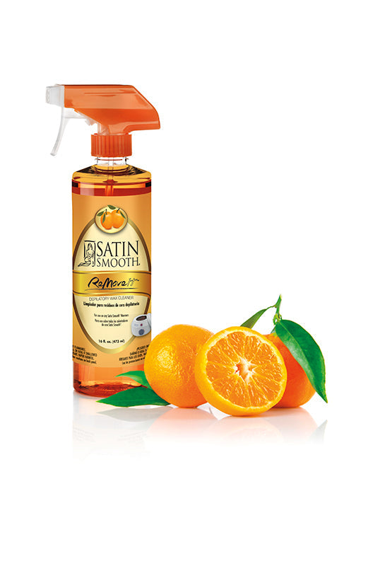 Display of a post-waxing treatment spray cleaner with ripe sliced tangerine citrus with leaf on the side