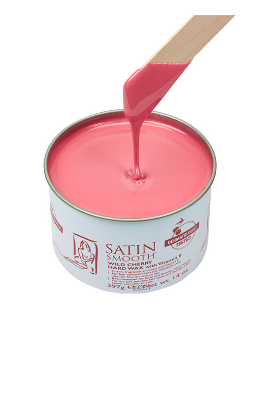 Dripping wax stick dipped into open can of Satin Smooth Cherry Hard Wax with Vitamin E showing its color & texture
