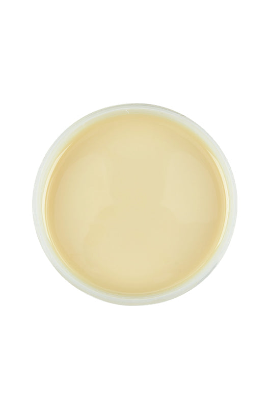 Top view of an open container of Satin Smooth beBare Hair Removal System Soy Wax featuring its creamy beige color